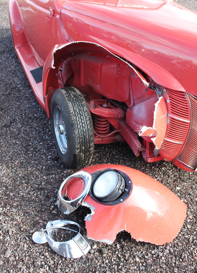 red fender of vintage car after crash