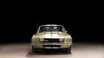 The front end of a light-green classic Shelby Cobra GT 500