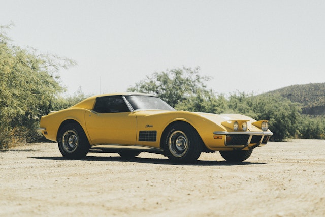 yellow corvette parked outside